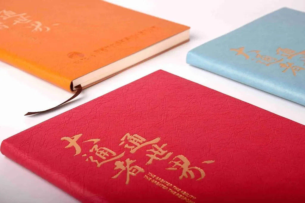 充皮纸与可水洗纸在文具本册中的应用