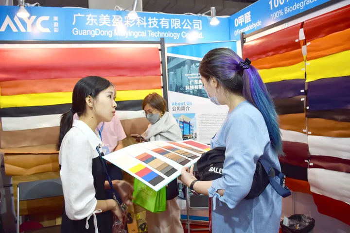 The MAYC team presenting material swatches